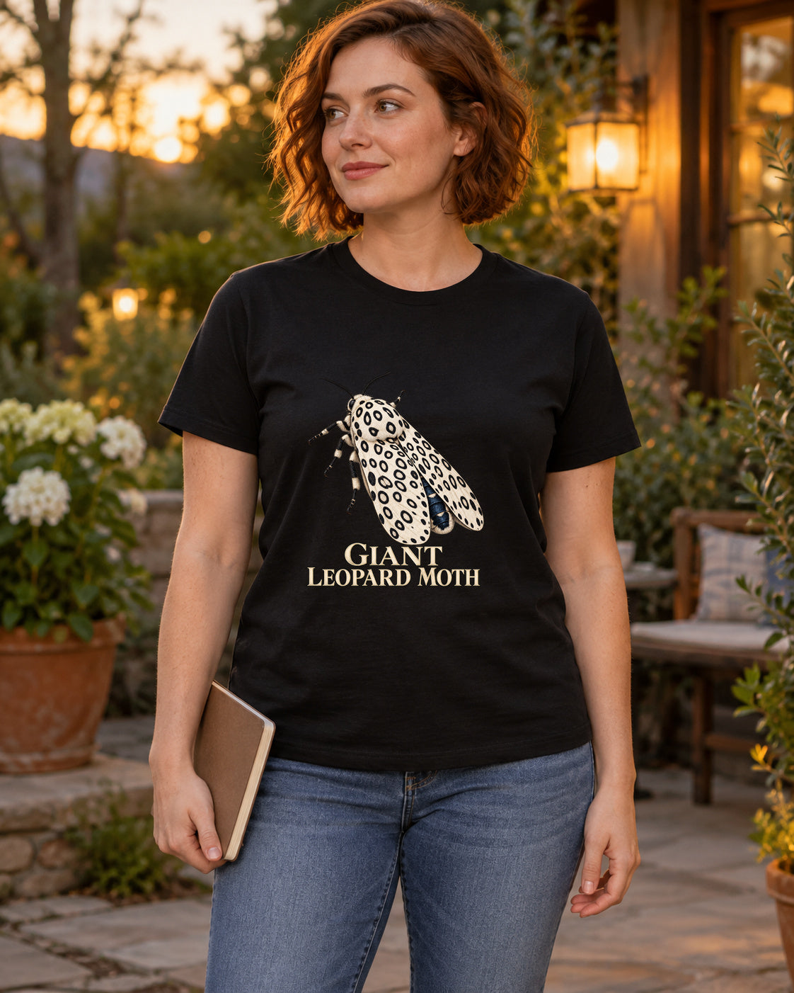 Giant Leopard Moth Entomology T-Shirt in black, shown in an illustrative lifestyle mockup.