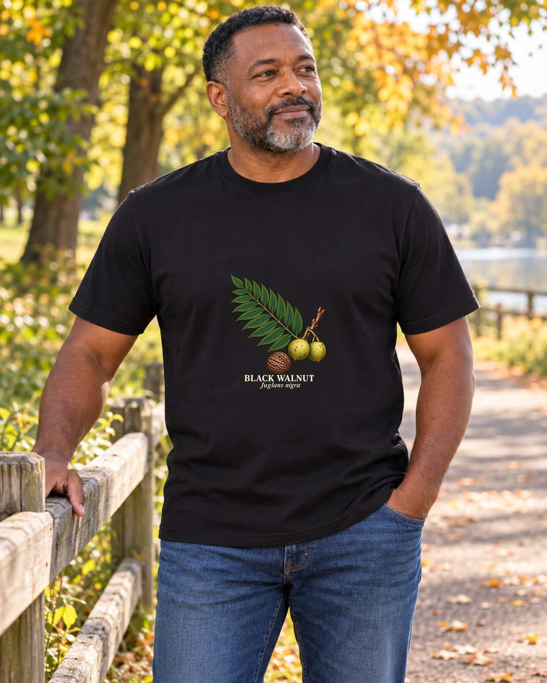 Black Walnut Botanical Study T-Shirt in black, shown in an illustrative lifestyle mockup.