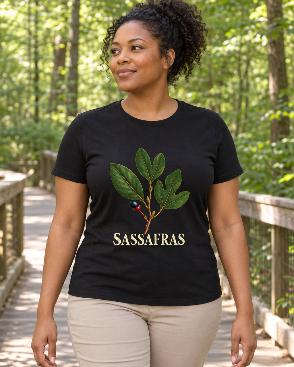 Sassafras Botanical Leaf Study T-Shirt in black, shown in an illustrative lifestyle mockup.