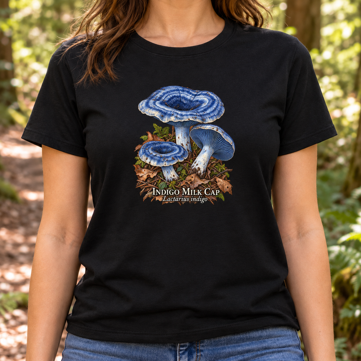 Lifestyle mockup of black Indigo Milk Cap T-shirt with modest centered chest print