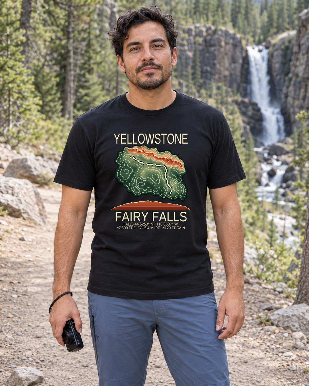 Illustrative lifestyle mockup of Fairy Falls Hiking T-Shirt | Yellowstone on a black shirt in a generated outdoor scene.