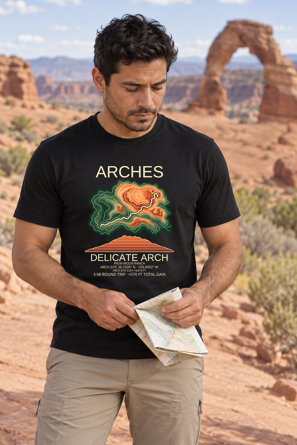 Illustrative lifestyle mockup of Delicate Arch Hiking T-Shirt | Arches on a black shirt in a generated outdoor scene.