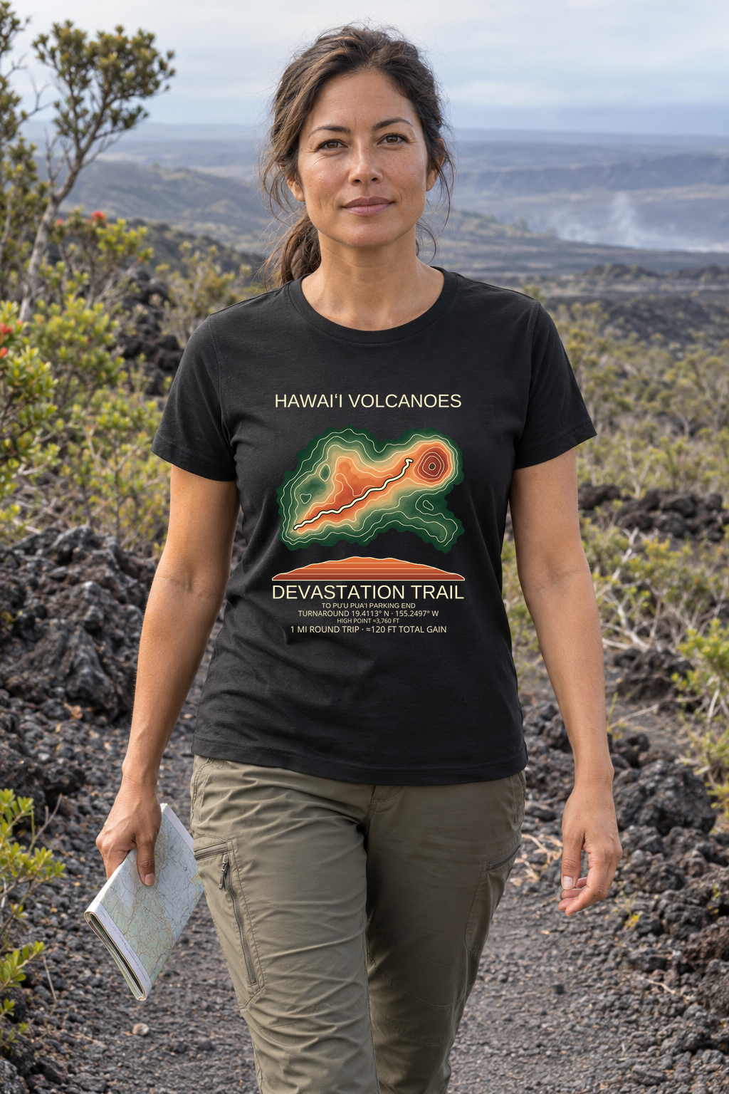 Illustrative lifestyle mockup of Devastation Trail Hiking T-Shirt | Hawaiʻi Volcanoes on a black shirt in a generated outdoor scene.