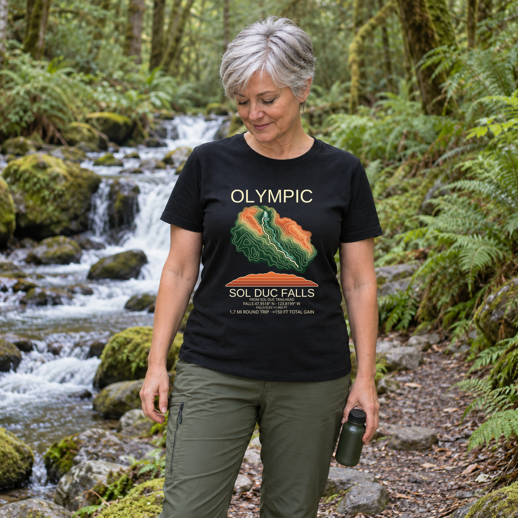 Illustrative lifestyle mockup of Sol Duc Falls Hiking T-Shirt | Olympic on a black shirt in a generated outdoor scene.