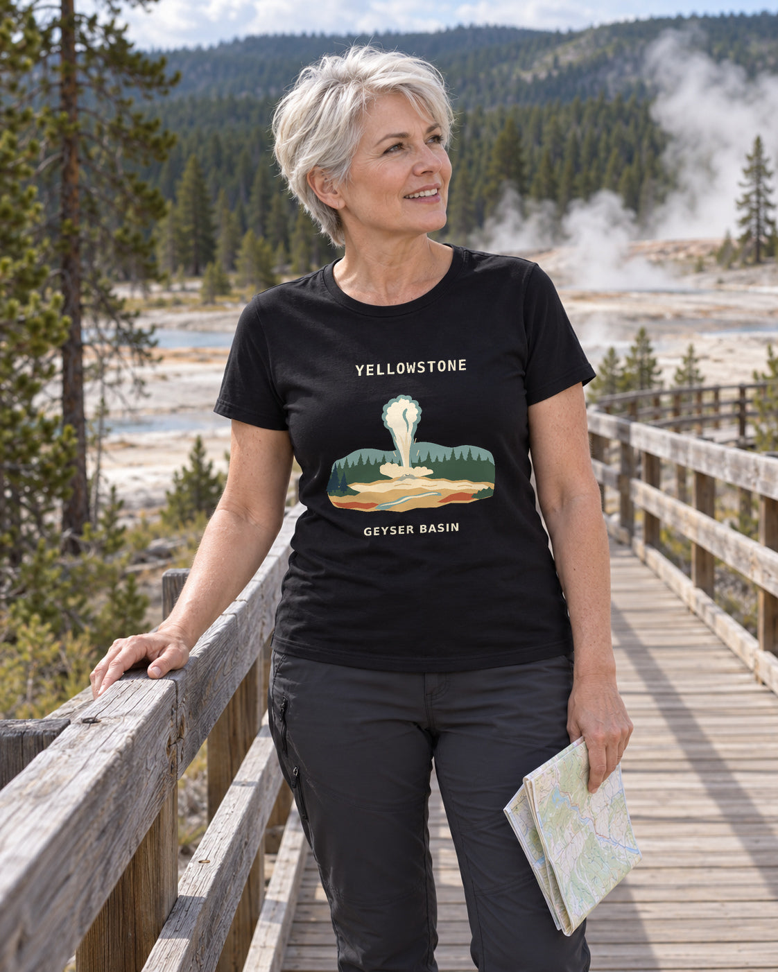 Illustrative lifestyle mockup of the Yellowstone Geyser Basin T-shirt on a black shirt in a generated outdoor scene.