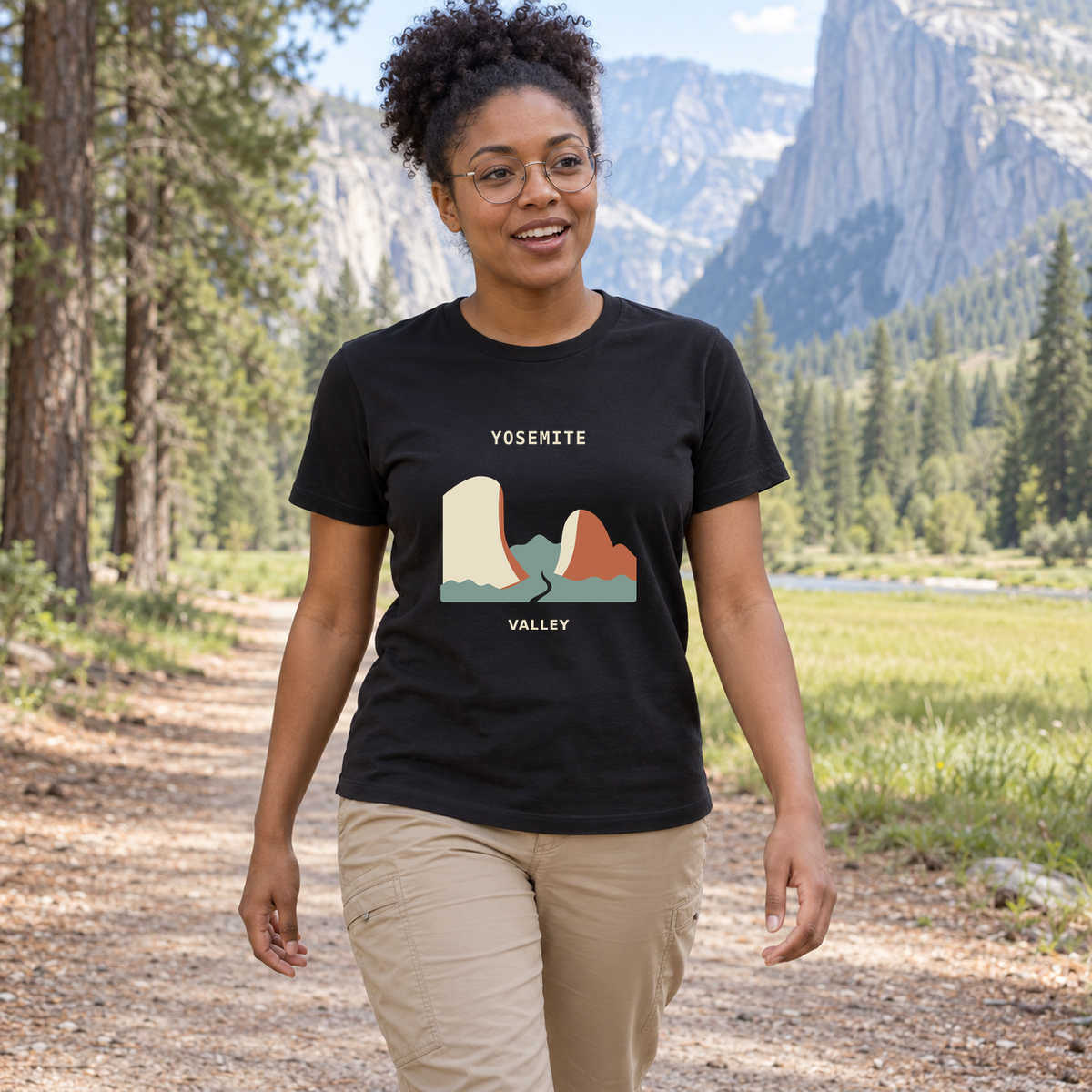 Illustrative lifestyle mockup of Yosemite Valley National Park Graphic T-Shirt on a black shirt in a generated outdoor scene.