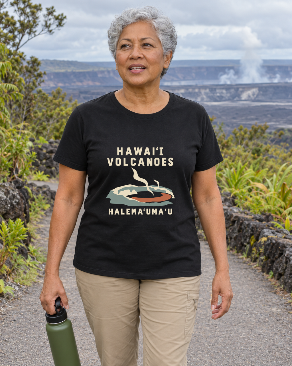 Illustrative lifestyle mockup of Halemaʻumaʻu T-Shirt | Hawaiʻi Volcanoes National Park on a black shirt in a generated outdoor scene.