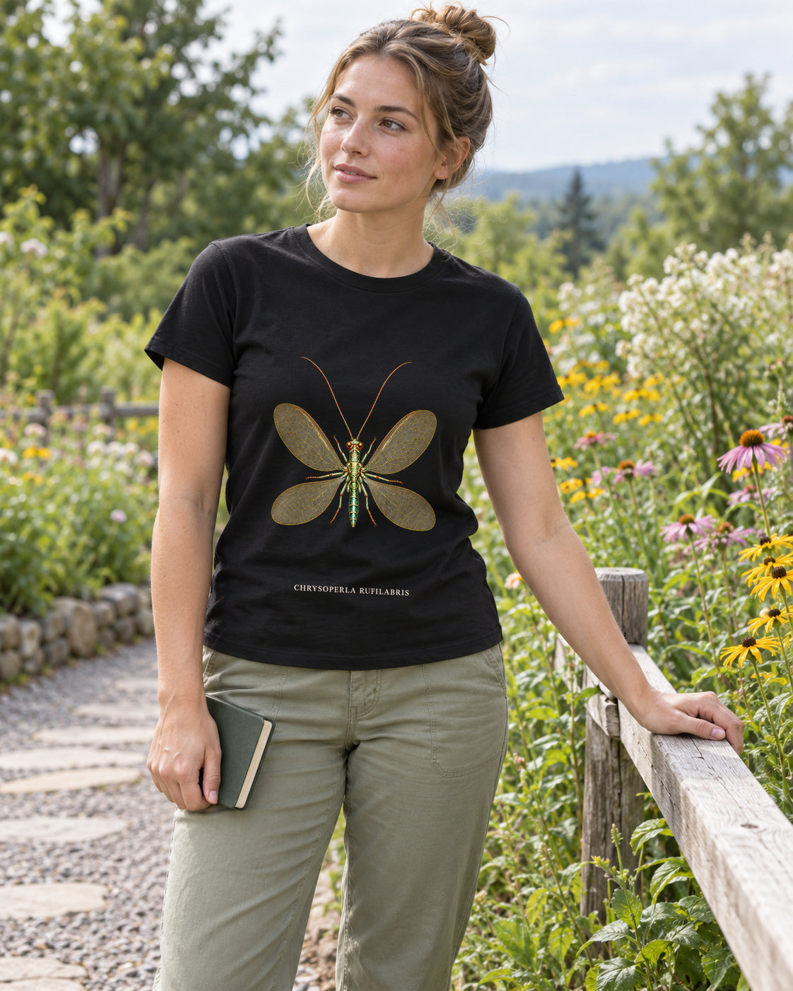 Illustrative lifestyle mockup of the Lacewing Natural History T-Shirt | Chrysoperla rufilabris on a black shirt in a generated scene.