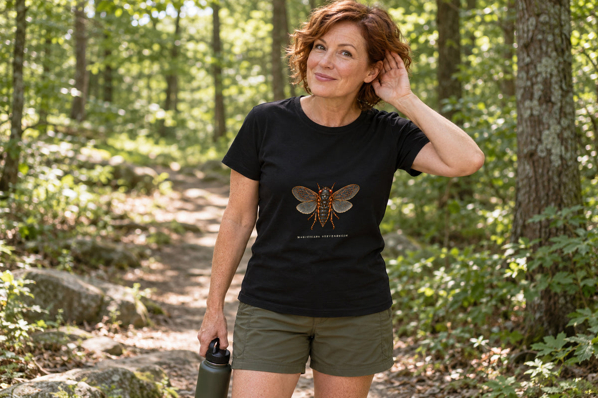 Illustrative lifestyle mockup of the Periodical Cicada Natural History T-Shirt on a black shirt in a generated scene.