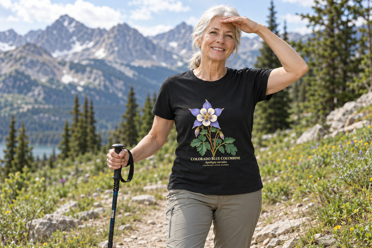 Illustrative lifestyle mockup of the Colorado Blue Columbine State Flower T-Shirt on a black shirt in a generated scene.