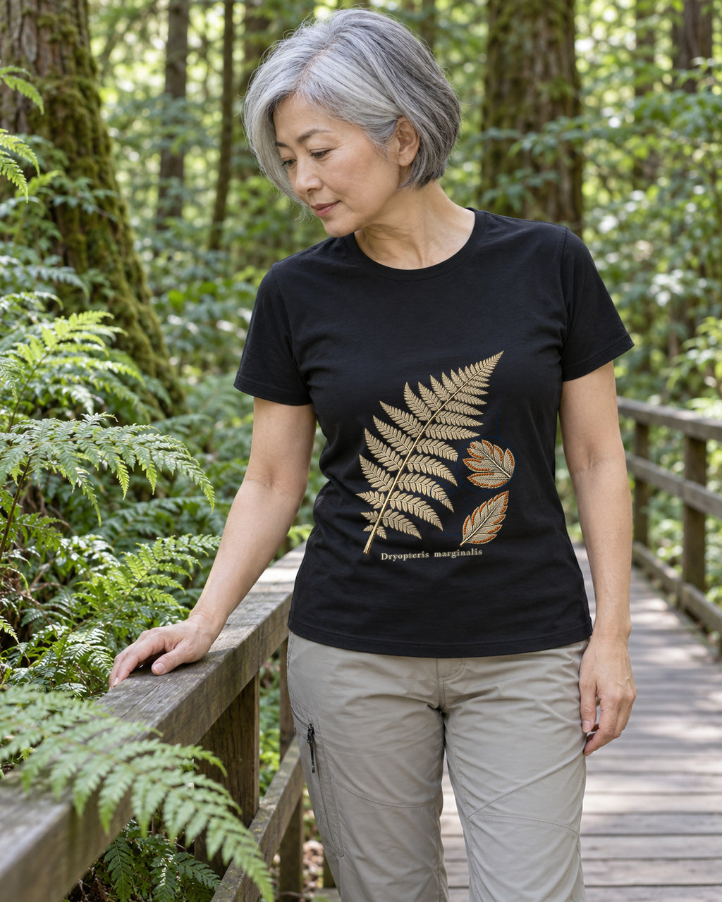 Illustrative lifestyle mockup of the Marginal Wood Fern Botanical T-Shirt on a black shirt in a generated scene.