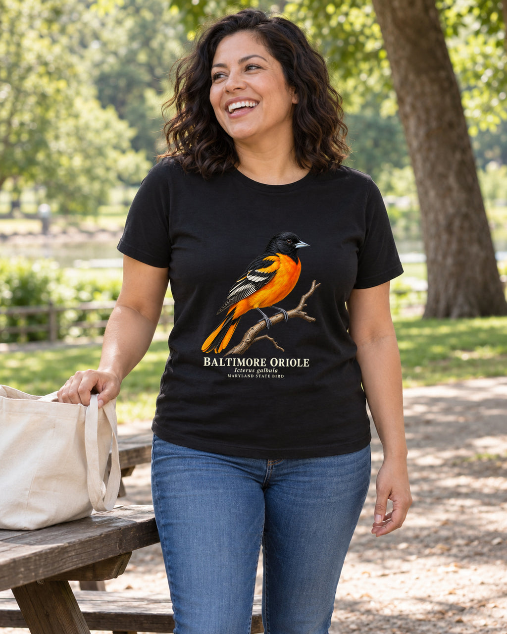 Illustrative lifestyle mockup of the Baltimore Oriole Maryland State Bird T-Shirt on a black shirt in a generated scene.