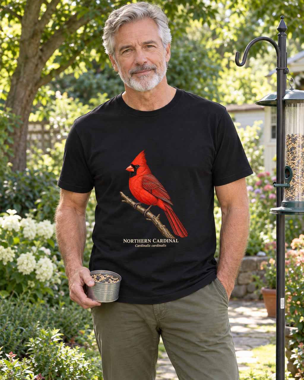 Illustrative lifestyle mockup of the Northern Cardinal Birdwatching T-Shirt on a black shirt in a generated scene.