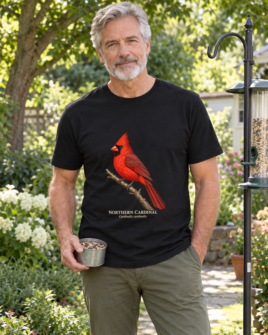 Illustrative lifestyle mockup of the Northern Cardinal Birdwatching T-Shirt on a black shirt in a generated scene.