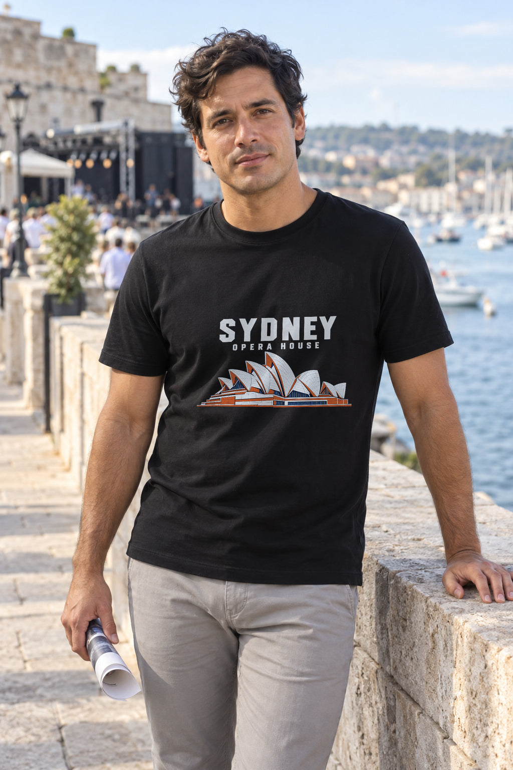 Illustrative lifestyle mockup of the Sydney Opera House Architecture T-Shirt on a black shirt in a generated scene.